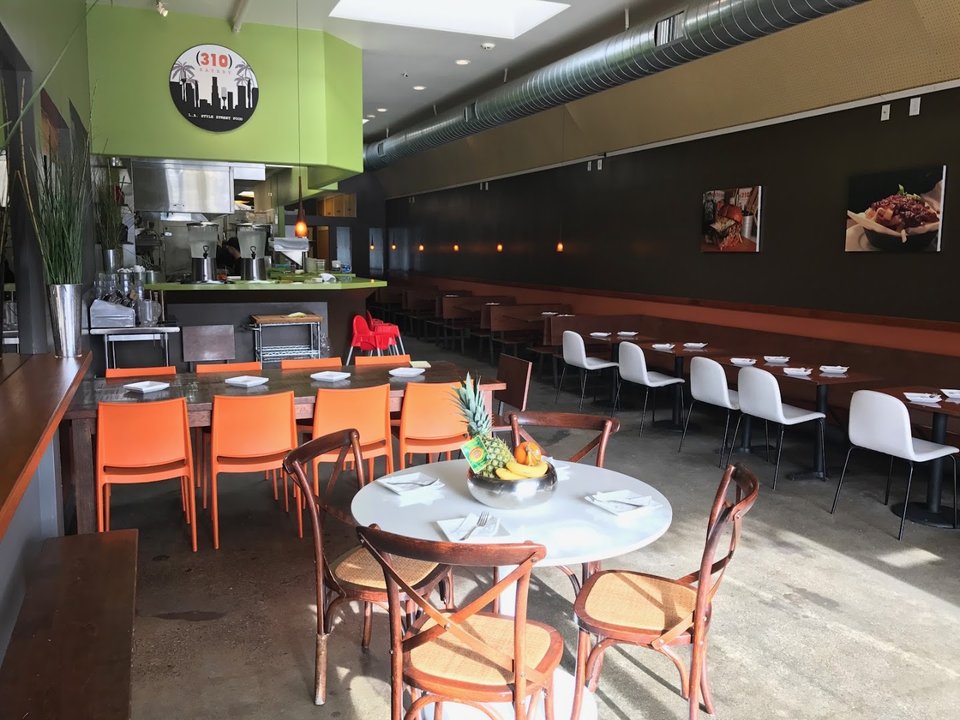 Burgers and fries served on a casual restaurant table.