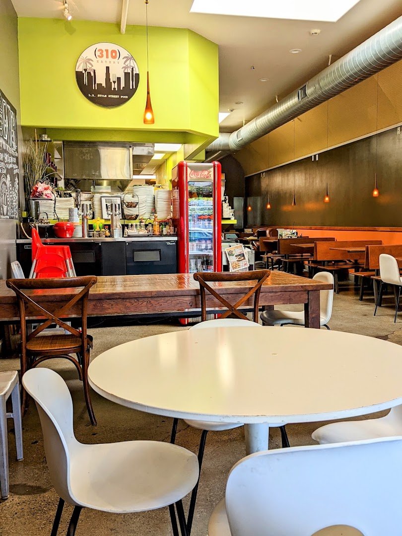 Burgers and fries served on a casual restaurant table.