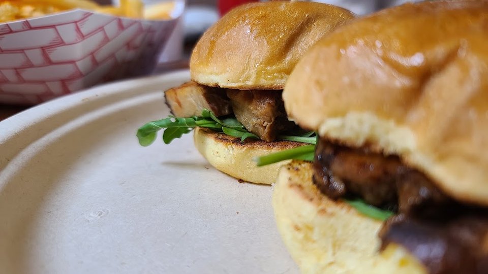 Varied menu with brunch, burgers, and sides.