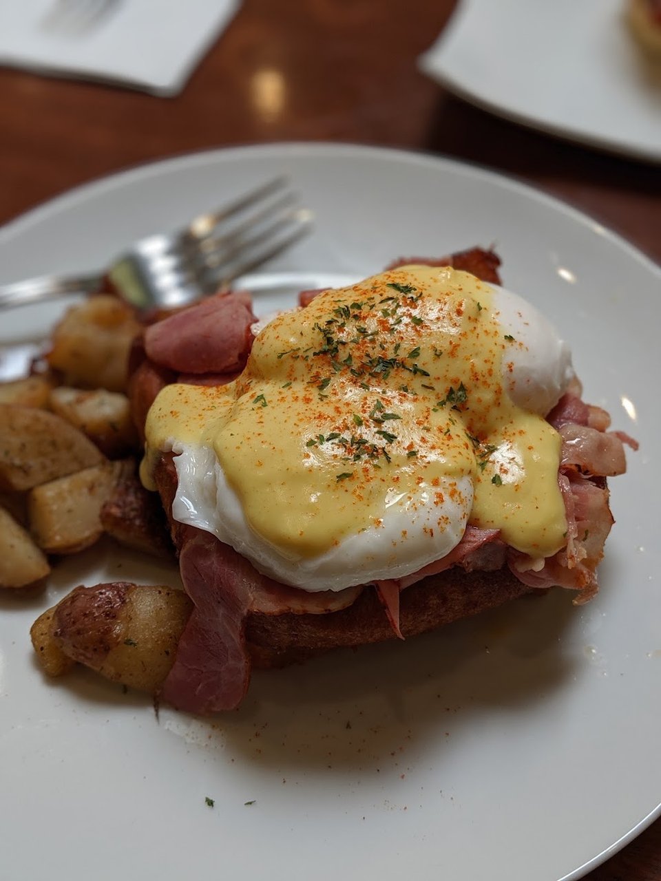 Breakfast menu with Benedicts, omelets, and French toast.