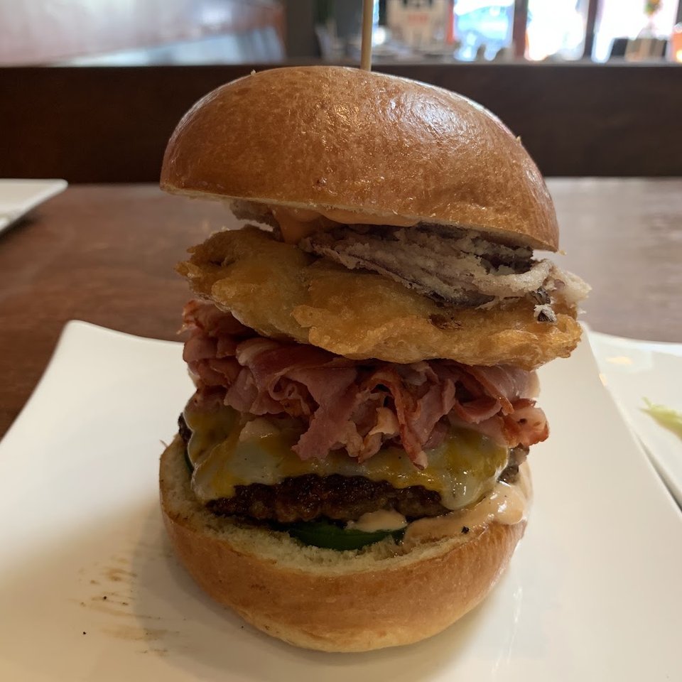 Varied menu with brunch, burgers, and sides.