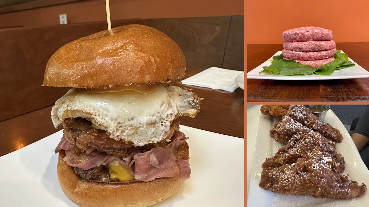 Burgers and fries served on a casual restaurant table.